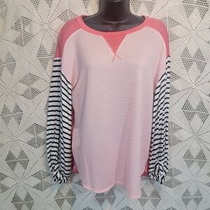 My story size small light sweat shirt. Pink with balck and white sleeves.
